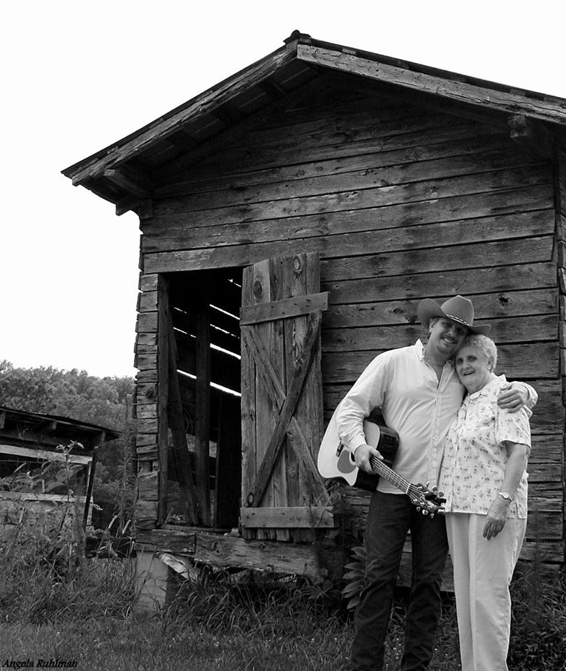 Man and woman by barn