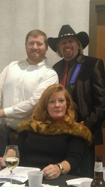 Three people posing together